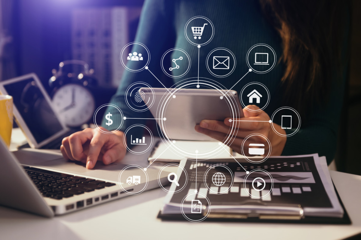 Businesswoman working with smart phone and laptop and digital t